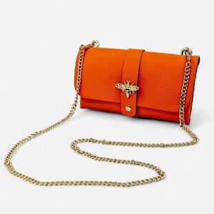 Orange leather bee clutch bag with detachable gold chain strap